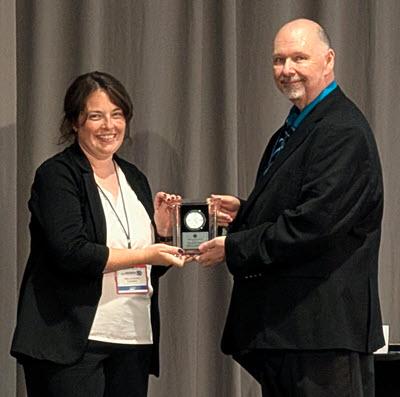 Kellianne Torres receives the 2026 Leadership Award from Chairperson Howard Wykes