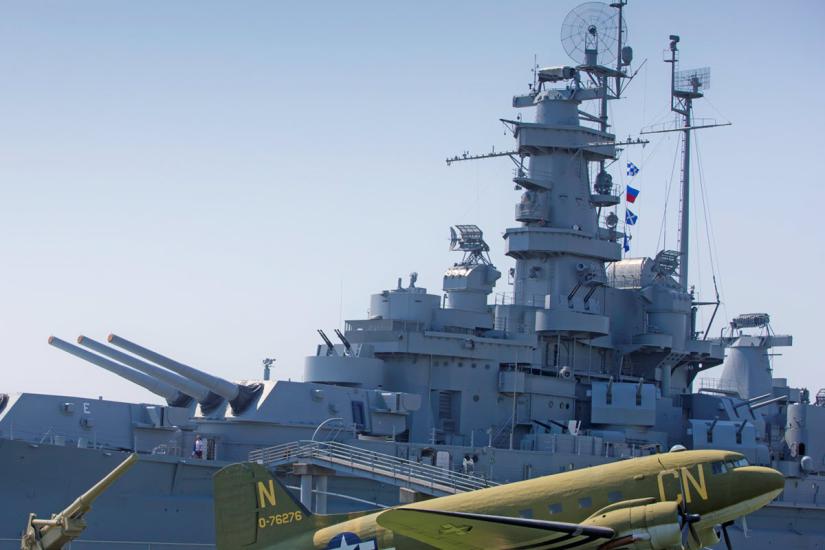 USS Alabama Battleship with plane in front